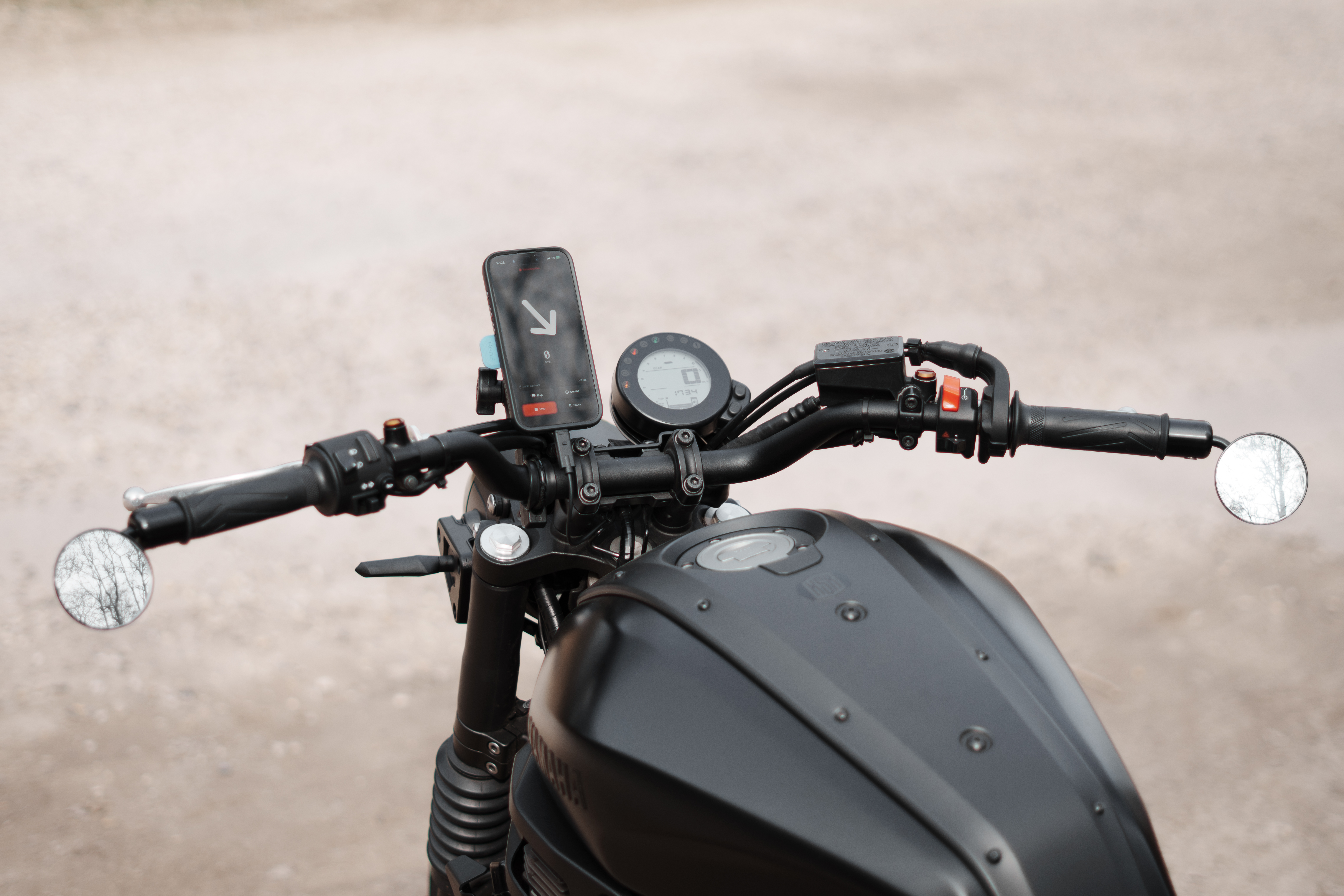 Heading motorcycle navigation app mounted on handlebars